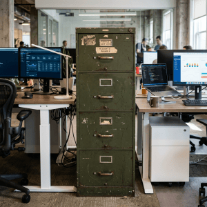 Weathered green filing cabinet labeled Accounts Payable in a modern office